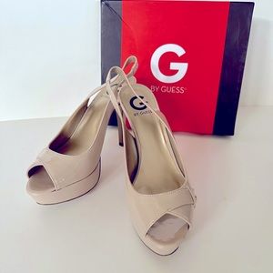 G by Guess patent leather sling-back platform heels.